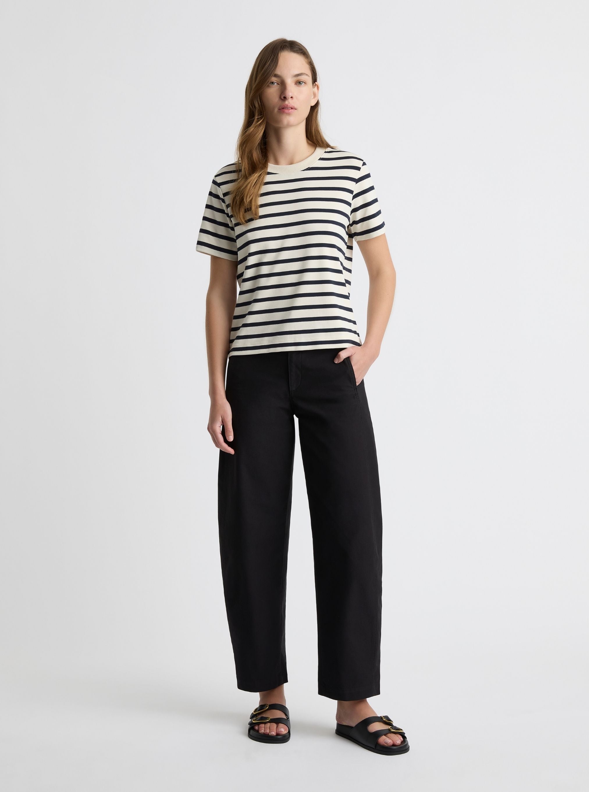 Stripe White/Navy|Black and white striped t-shirt on a light gray background|Zenya is 5'10" and wearing a size S