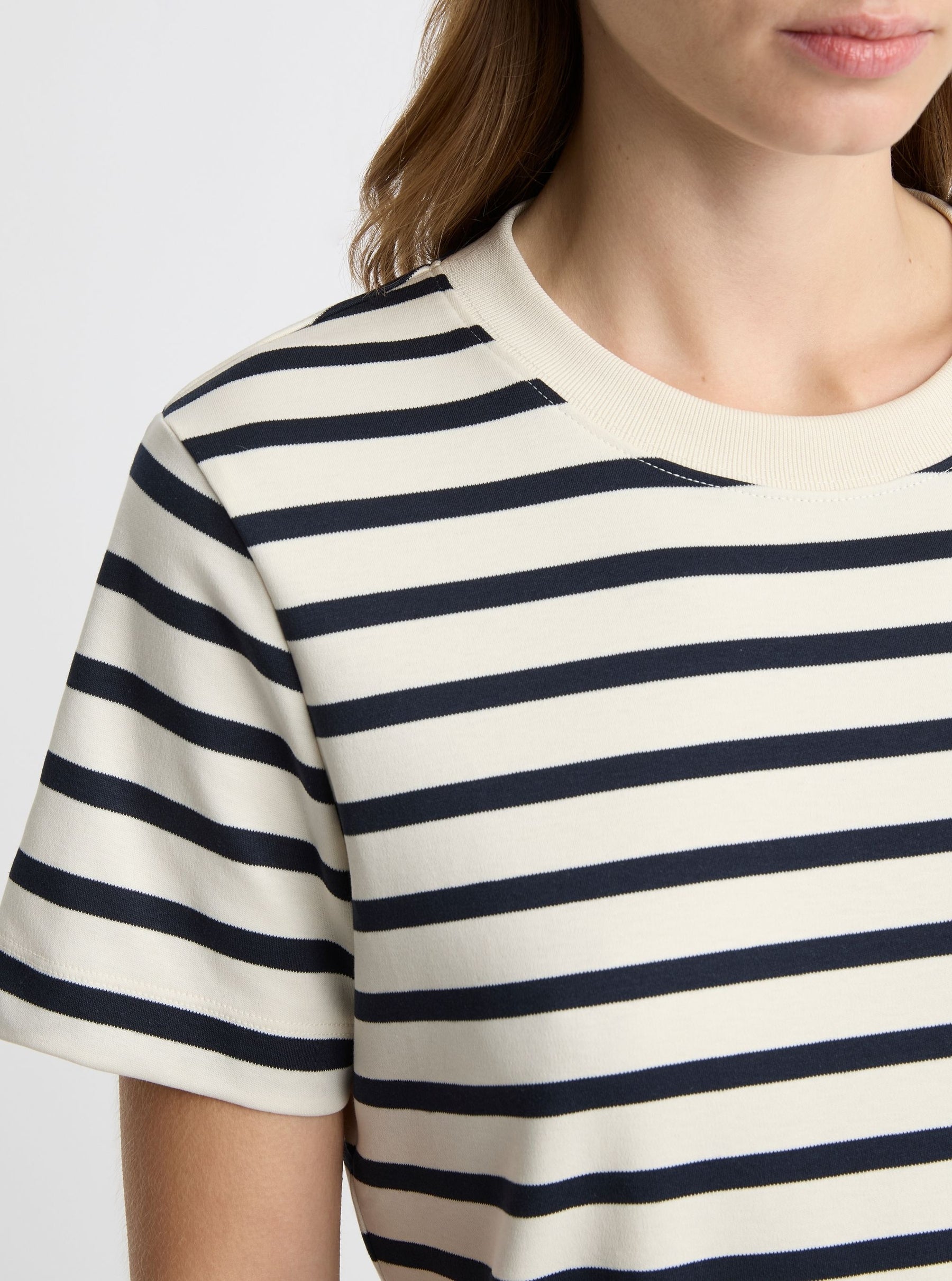 Stripe White/Navy|Black and white striped t-shirt on a light gray background|Zenya is 5'10" and wearing a size S