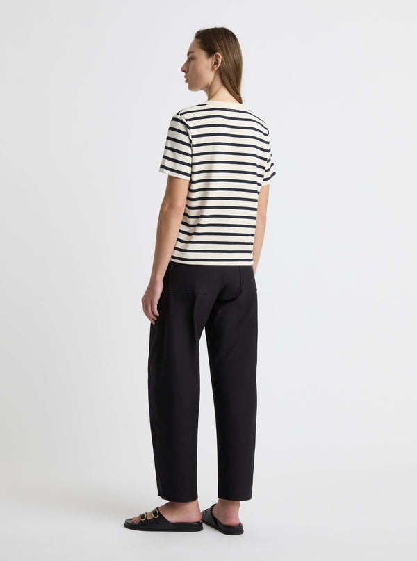 Stripe White/Navy|Black and white striped t-shirt on a light gray background|Zenya is 5'10" and wearing a size S