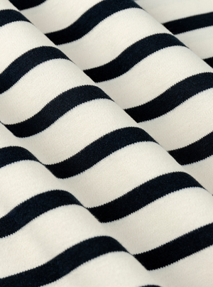 Stripe White/Navy|Black and white striped t-shirt on a light gray background|Stripe White/Navy