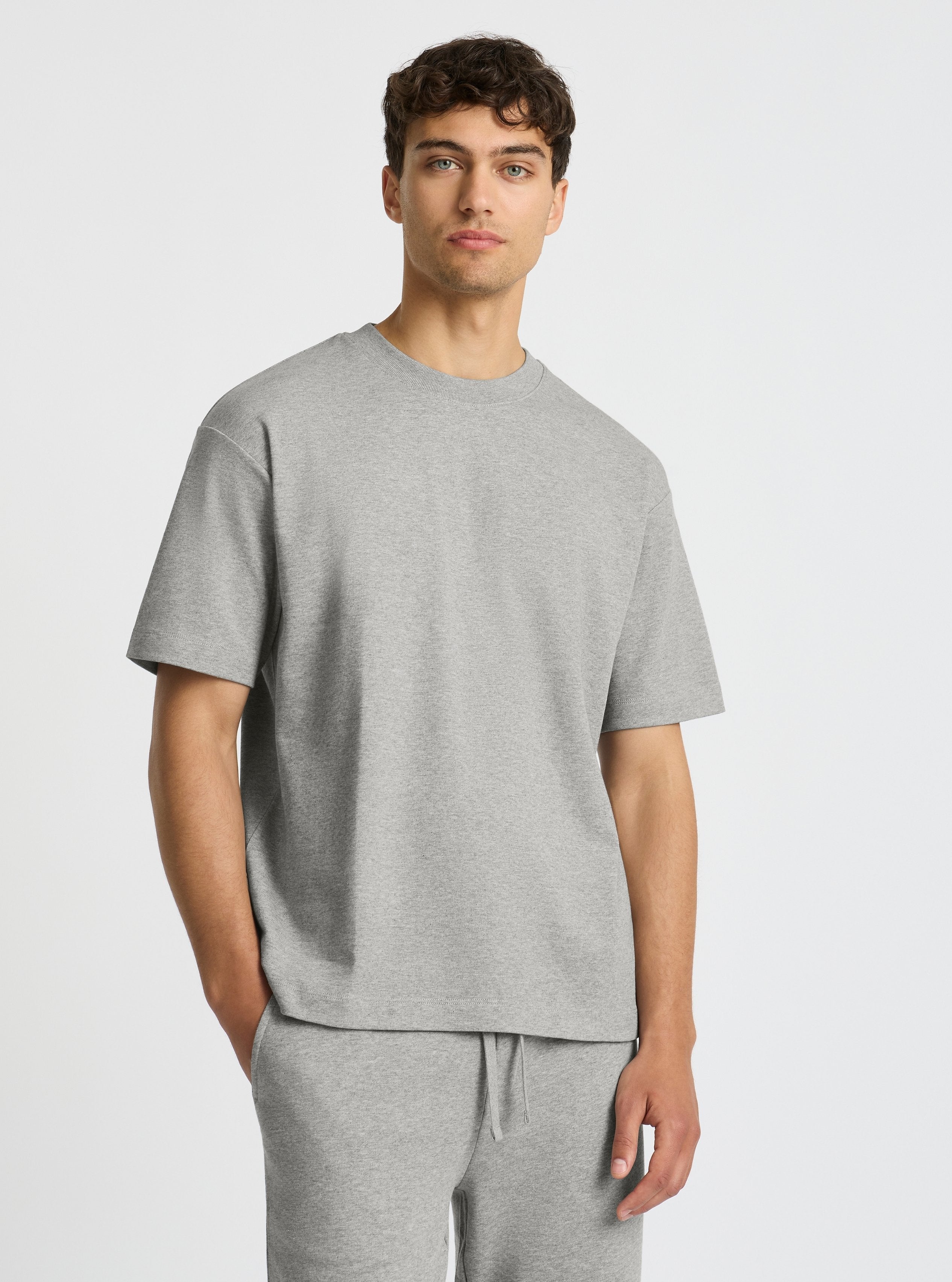 Grey Marl|Evans is 6’2” and wearing a size M