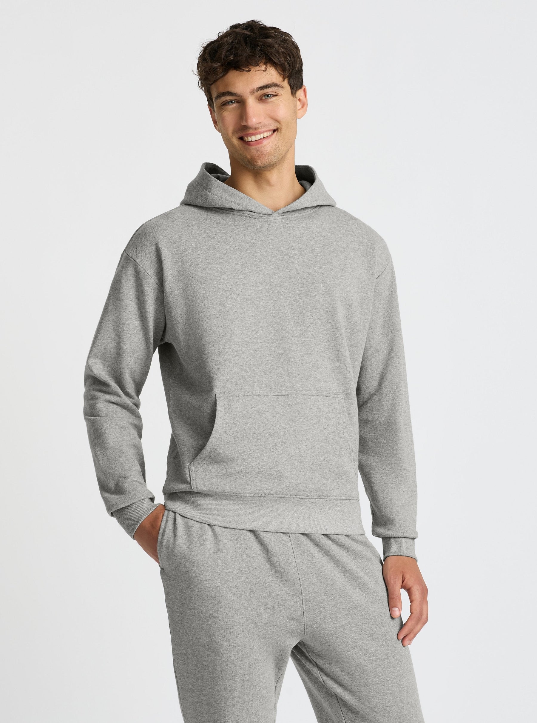 Grey Marl|Good Earth Cotton® Hoodie for men – Sustainable Cotton Hoodie|Evans is 6’2” and wearing a size M